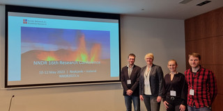 Presenters at the NNDR Conference 2023 Four persons in front of a Power Point presentation at the 16th Research Conference of the Nordic Network on Disability Research (NNDR). From left to right Bastian Pelka, Lena Hünefeld, Sophie Teborg, and Frederik Winkelkotte.